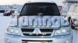 Корпуса под линзованную оптику перед Mitsubishi Pajero 3 (2000-2006)